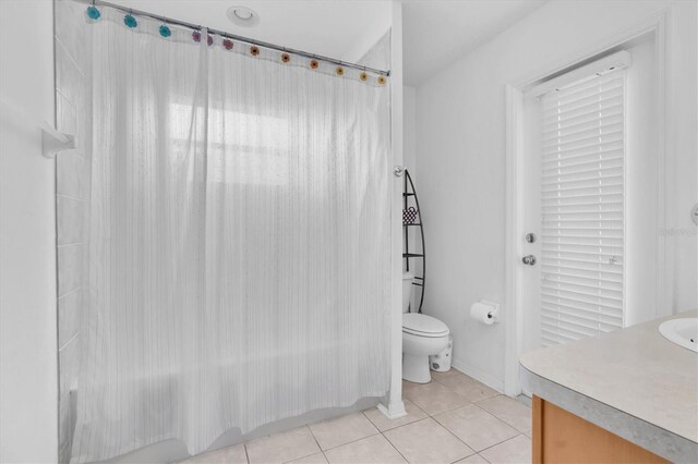 6109 Japonica Ct, New Port Richey, FL 34655 - full bath featuring tile patterned flooring, vanity, and toilet