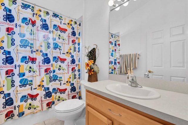 6109 Japonica Ct, New Port Richey, FL 34655 - full bathroom with toilet, tile patterned floors, and vanity
