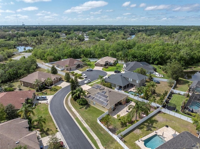 6109 Japonica Ct, New Port Richey, FL 34655 - birds eye view of property featuring a water view, a wooded view, and a residential view