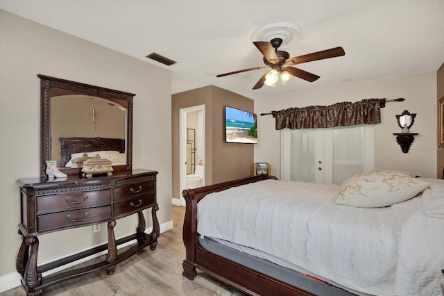 bedroom featuring visible vents, light wood-style flooring, baseboards, and ceiling fan
