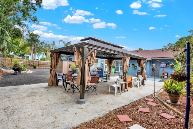 view of patio / terrace featuring fence and a gazebo