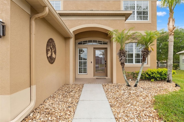 4335 Canongate Ct, Spring Hill, FL 34609 - doorway to property featuring stucco siding