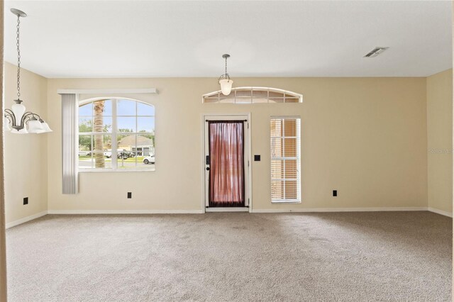 4335 Canongate Ct, Spring Hill, FL 34609 - carpeted entryway featuring baseboards