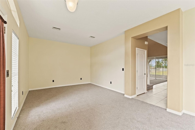 4335 Canongate Ct, Spring Hill, FL 34609 - unfurnished room with carpet flooring, baseboards, and tile patterned floors