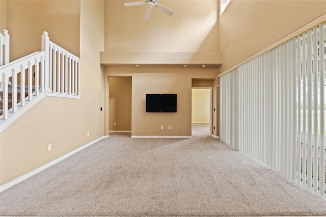 4335 Canongate Ct, Spring Hill, FL 34609 - unfurnished living room with a high ceiling, carpet, a ceiling fan, and baseboards