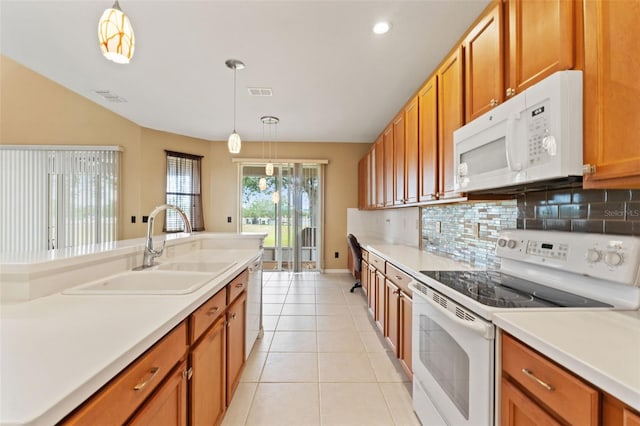 4335 Canongate Ct, Spring Hill, FL 34609 - kitchen featuring white appliances, a sink, backsplash, brown cabinetry, and light tile patterned flooring