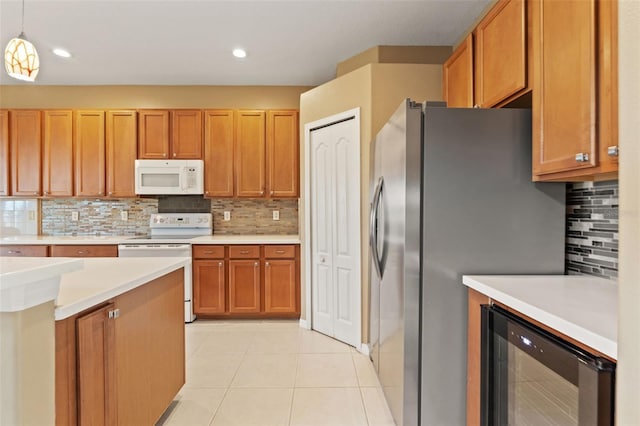 4335 Canongate Ct, Spring Hill, FL 34609 - kitchen with white appliances, beverage cooler, decorative backsplash, light countertops, and light tile patterned floors