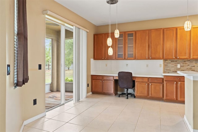 4335 Canongate Ct, Spring Hill, FL 34609 - office featuring built in study area, light tile patterned floors, and baseboards