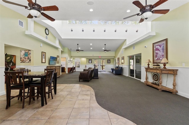 4335 Canongate Ct, Spring Hill, FL 34609 - dining area featuring a ceiling fan, a high ceiling, light carpet, light tile patterned floors, and recessed lighting