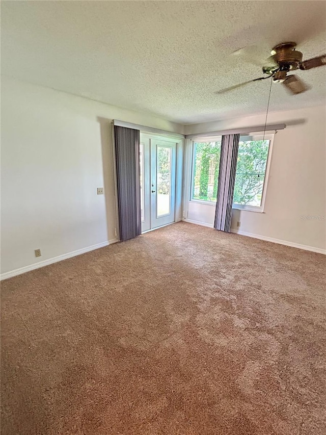 7444 Candlelight Ct, New Port Richey, FL 34652 - carpeted empty room featuring a ceiling fan and a textured ceiling