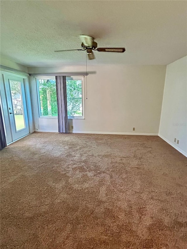 7444 Candlelight Ct, New Port Richey, FL 34652 - carpeted spare room featuring a textured ceiling and ceiling fan