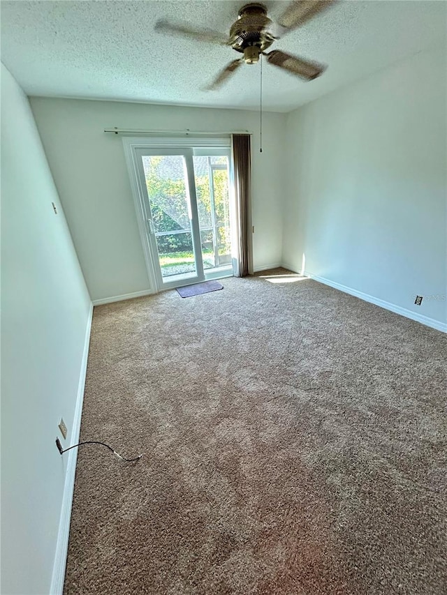 7444 Candlelight Ct, New Port Richey, FL 34652 - empty room featuring a textured ceiling, carpet floors, and ceiling fan