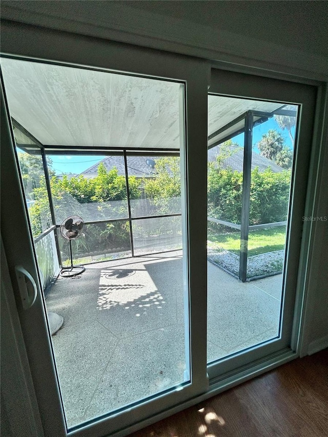 7444 Candlelight Ct, New Port Richey, FL 34652 - doorway to outside with wood finished floors