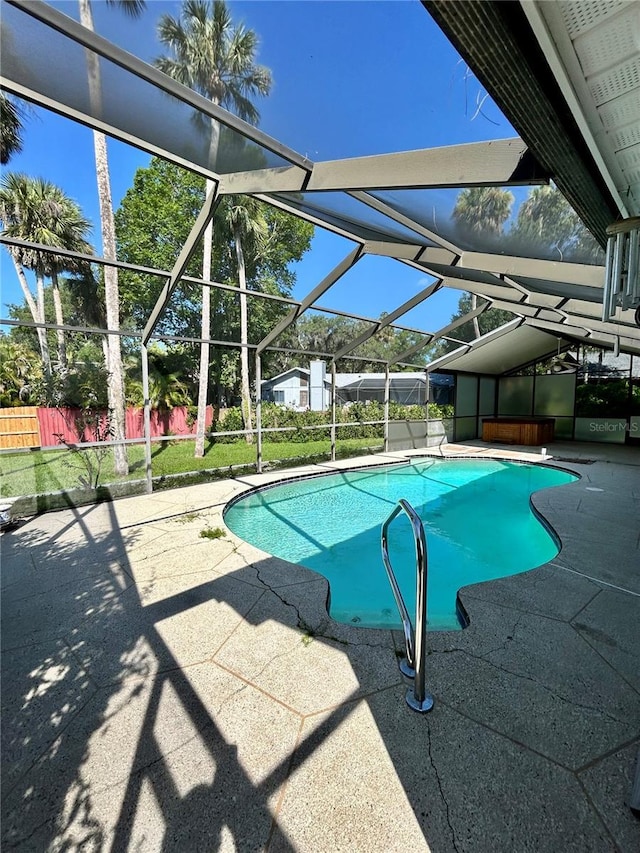 7444 Candlelight Ct, New Port Richey, FL 34652 - view of pool featuring a patio area and glass enclosure