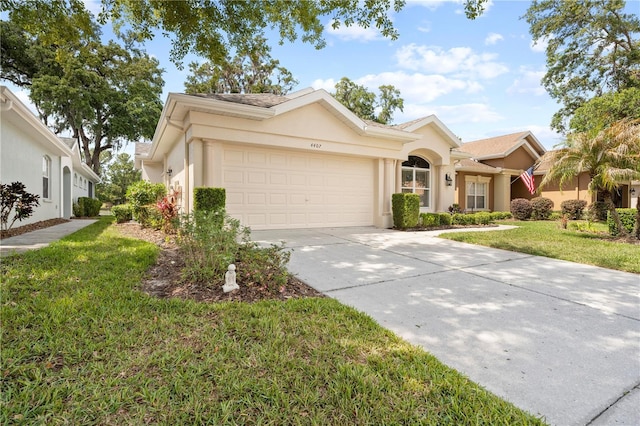 4407 Caliquen Dr, Brooksville, FL 34604 - single story home with a garage, a front yard, driveway, and stucco siding