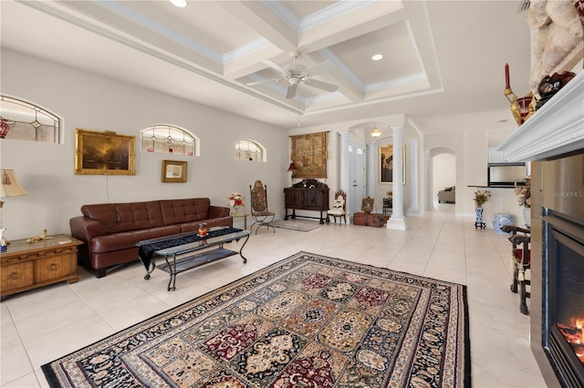 4407 Caliquen Dr, Brooksville, FL 34604 - living room featuring beamed ceiling, arched walkways, ornate columns, a ceiling fan, and coffered ceiling