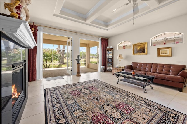 4407 Caliquen Dr, Brooksville, FL 34604 - living area featuring light tile patterned floors, a ceiling fan, beamed ceiling, coffered ceiling, and a high end fireplace