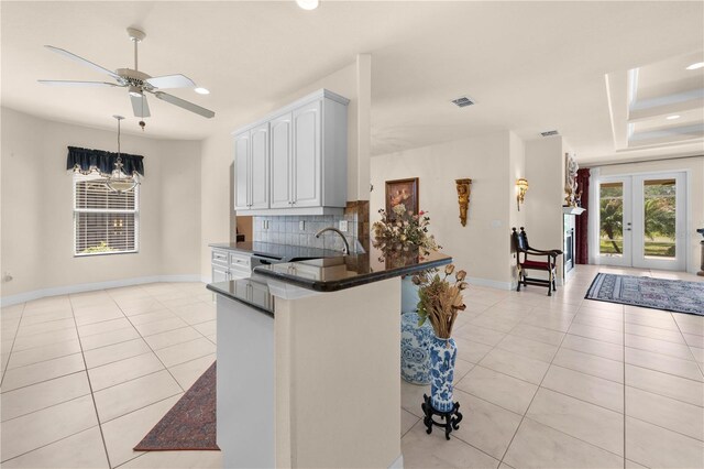 4407 Caliquen Dr, Brooksville, FL 34604 - kitchen featuring light tile patterned floors, dark countertops, and plenty of natural light
