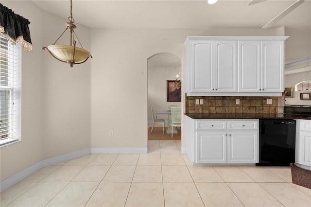 4407 Caliquen Dr, Brooksville, FL 34604 - kitchen featuring tasteful backsplash, dark countertops, arched walkways, and dishwasher