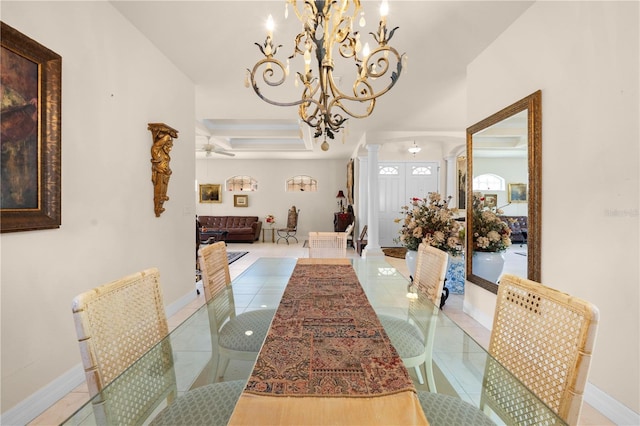 4407 Caliquen Dr, Brooksville, FL 34604 - dining area with tile patterned floors, baseboards, ornate columns, and ceiling fan with notable chandelier