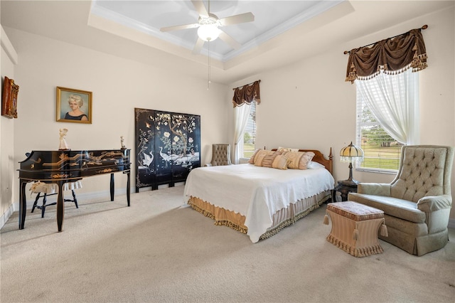 4407 Caliquen Dr, Brooksville, FL 34604 - bedroom with a tray ceiling, ornamental molding, a ceiling fan, and carpet floors