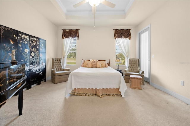 4407 Caliquen Dr, Brooksville, FL 34604 - carpeted bedroom with ornamental molding, a tray ceiling, baseboards, and a ceiling fan
