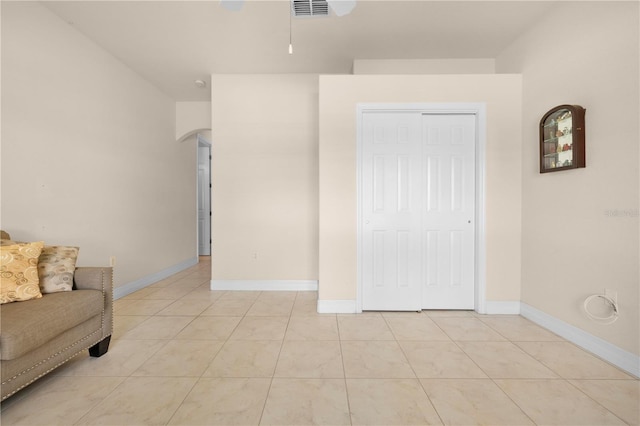 4407 Caliquen Dr, Brooksville, FL 34604 - sitting room featuring baseboards, light tile patterned floors, visible vents, ceiling fan, and arched walkways