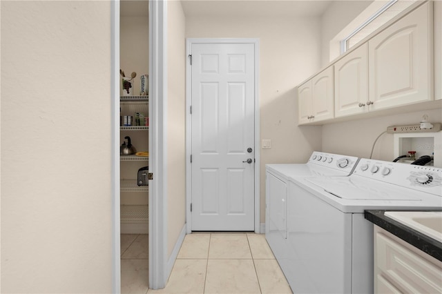 4407 Caliquen Dr, Brooksville, FL 34604 - laundry room featuring washer and dryer, light tile patterned floors, and cabinet space