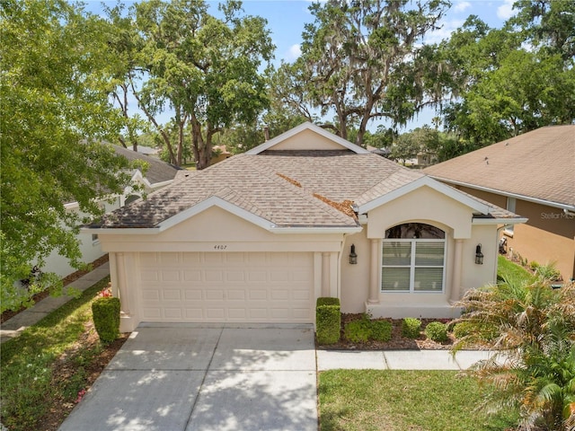 4407 Caliquen Dr, Brooksville, FL 34604 - ranch-style home with an attached garage, a shingled roof, concrete driveway, and stucco siding