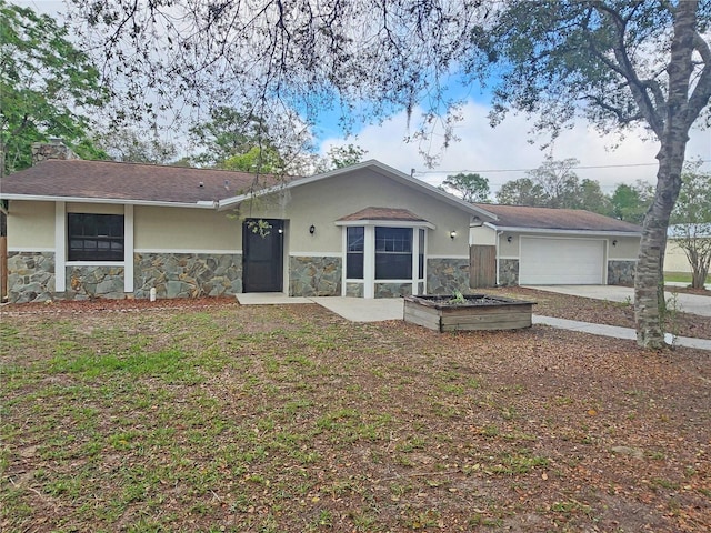 18232 Monteverde Dr, Spring Hill, FL 34610 - ranch-style house featuring stucco siding, stone siding, a chimney, and an attached garage