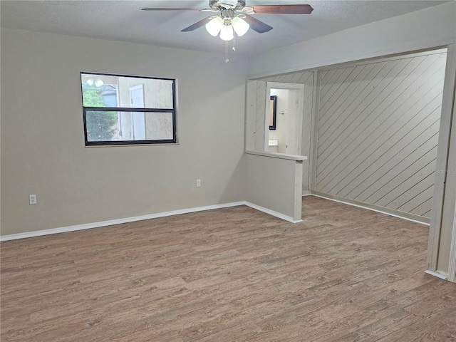 18232 Monteverde Dr, Spring Hill, FL 34610 - empty room featuring ceiling fan, baseboards, and wood finished floors
