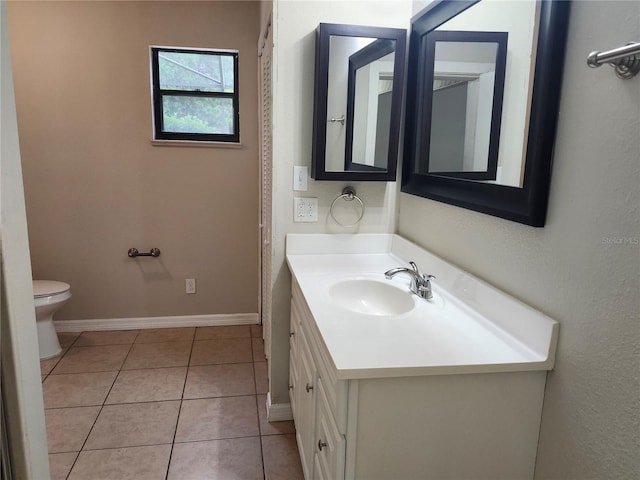 18232 Monteverde Dr, Spring Hill, FL 34610 - bathroom featuring tile patterned flooring, vanity, baseboards, and toilet