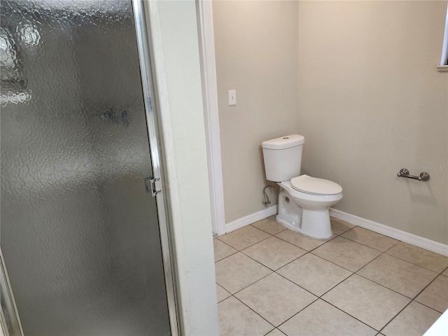 18232 Monteverde Dr, Spring Hill, FL 34610 - full bathroom featuring toilet, tile patterned flooring, a stall shower, and baseboards