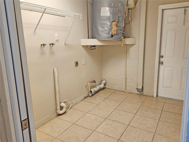 18232 Monteverde Dr, Spring Hill, FL 34610 - laundry area featuring laundry area, hookup for an electric dryer, gas dryer hookup, and light tile patterned floors
