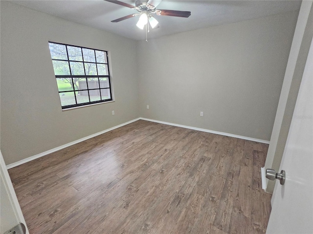 18232 Monteverde Dr, Spring Hill, FL 34610 - empty room with baseboards, a ceiling fan, and wood finished floors