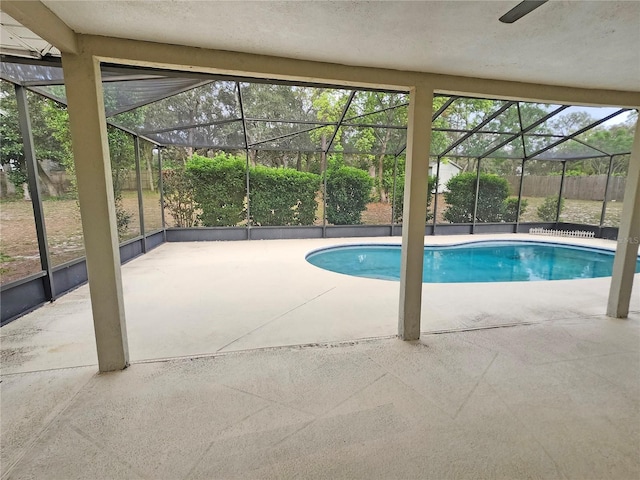 18232 Monteverde Dr, Spring Hill, FL 34610 - pool featuring a patio, glass enclosure, and fence
