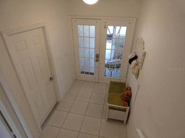 entryway featuring french doors and light tile patterned floors
