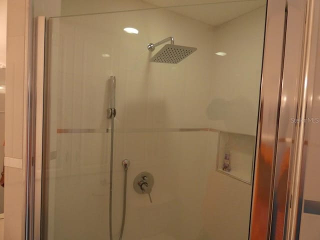 bathroom with a shower stall