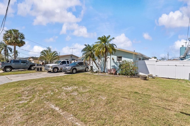 13815 Plumosa Ave, Hudson, FL 34667 - view of yard with fence and concrete driveway