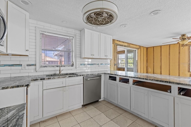 13815 Plumosa Ave, Hudson, FL 34667 - kitchen with a sink, stainless steel dishwasher, white cabinetry, and a textured ceiling