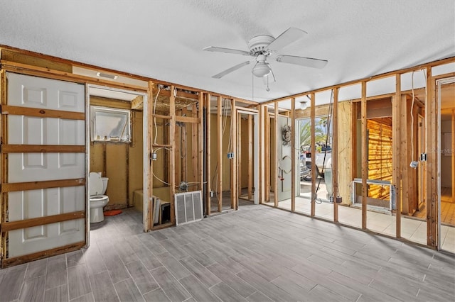 13815 Plumosa Ave, Hudson, FL 34667 - misc room featuring a textured ceiling, wood finished floors, a ceiling fan, and visible vents