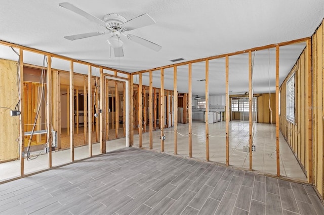 13815 Plumosa Ave, Hudson, FL 34667 - miscellaneous room with visible vents, wood finished floors, and ceiling fan
