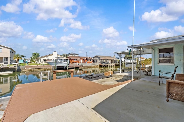 13815 Plumosa Ave, Hudson, FL 34667 - view of patio / terrace with a dock, a residential view, and a water view