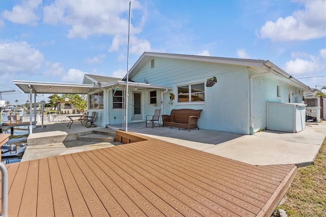 13815 Plumosa Ave, Hudson, FL 34667 - rear view of property with a patio area and stucco siding