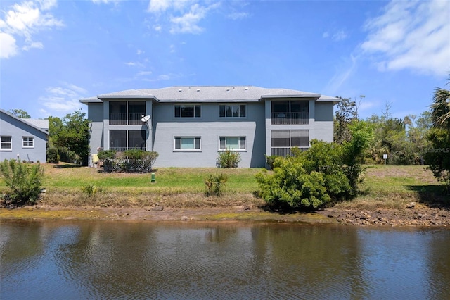 11274 W Cove Harbor Dr Unit 11274, Crystal River, FL 34428 - back of house with stucco siding and a water view