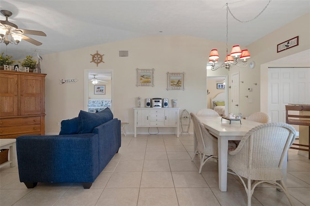 11274 W Cove Harbor Dr Unit 11274, Crystal River, FL 34428 - dining space with ceiling fan, lofted ceiling, light tile patterned floors, and a chandelier