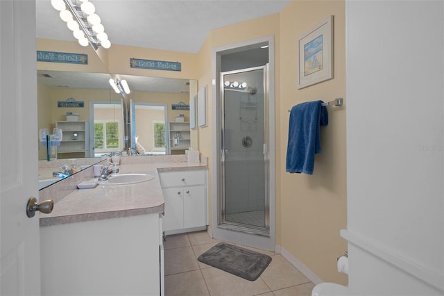 11274 W Cove Harbor Dr Unit 11274, Crystal River, FL 34428 - bathroom featuring a stall shower, tile patterned flooring, vanity, and baseboards