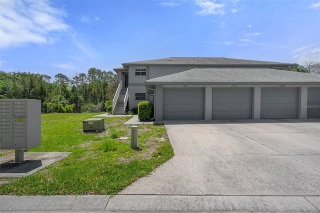 11274 W Cove Harbor Dr Unit 11274, Crystal River, FL 34428 - view of front of home with a front yard, stairs, stucco siding, and roof with shingles