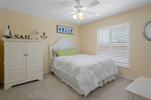 11274 W Cove Harbor Dr Unit 11274, Crystal River, FL 34428 - bedroom with light carpet, baseboards, and ceiling fan