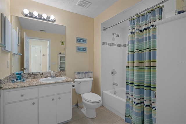 11274 W Cove Harbor Dr Unit 11274, Crystal River, FL 34428 - full bathroom with tile patterned floors, shower / tub combo with curtain, toilet, vanity, and a textured ceiling